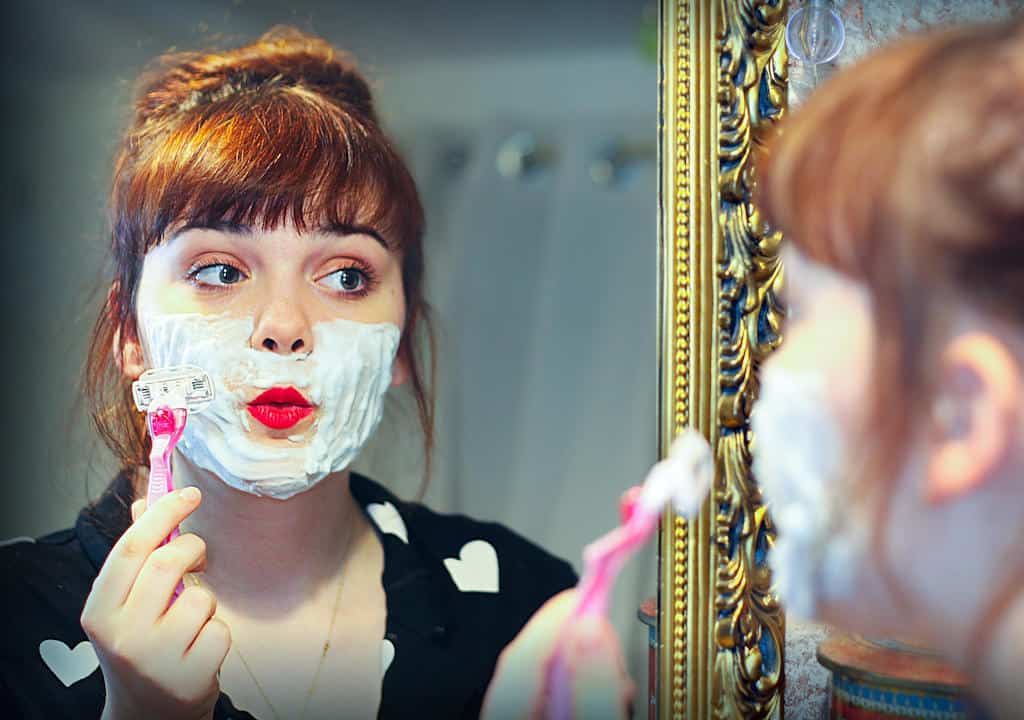 Woman Facial Hair Removal With Shaver